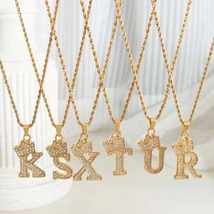 Golden crown initial pendant necklaces with cubic zirconia on elegant rope chains