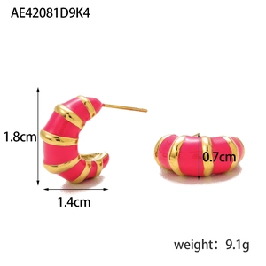 Detail view of gold-plated croissant earrings with fuchsia enamel stripes and 1.8cm size