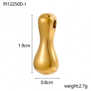 Macro detail of 14K gold-plated bubble pendant with 1.9cm height and mirror finish