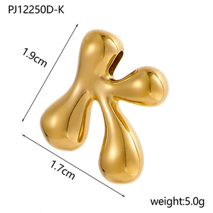 Detailed view of polished 14K gold-plated bubble 'K' pendant showing dimensions 1.9cm x 1.7cm