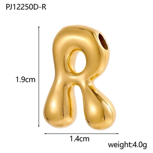 Macro view of 14K gold plated bubble letter R pendant with 1.9cm height dimensions