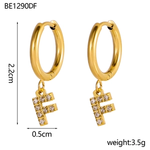 Detail of gold letter F hoop earrings with pavé zircons and size measurement labels