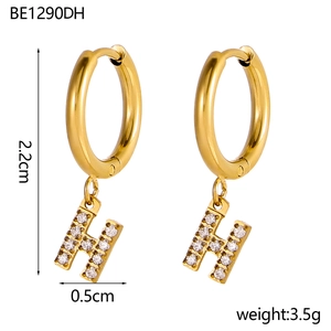 Close-up of 18K gold-plated stainless steel hoop earrings with zircon H pendant