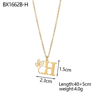 Detailed view of an 18K gold plated stainless steel letter H pendant with female profile