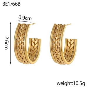 Detail view of gold C-shaped earrings with woven texture and 2.6cm dimensions