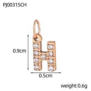 Macro detail of rose gold letter H pendant with pavé cubic zirconia measuring 0.9x0.5cm