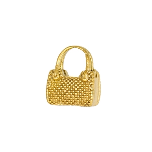 Macro detail of a 18K gold plated handbag charm with quilted metal texture