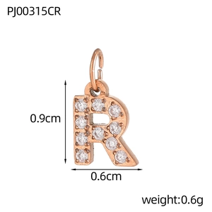 Detail of rose gold letter R pendant with white zircon pavé and dimensions 0.9x0.6cm