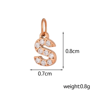 Macro shot of rose gold letter S pendant with white cubic zirconia and size dimensions