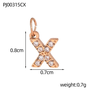 Macro detail of rose gold letter X pendant with white cubic zirconia and size measurements