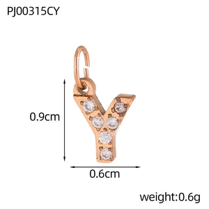 Macro detail of rose gold Y-letter pendant with micro-pave cubic zirconia crystals
