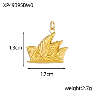 Macro detail of 18K gold plated Sydney Opera House pendant with hollow relief texture