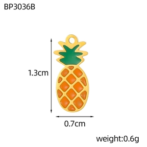 Detail view of a 1.3cm pineapple charm with 18K gold plating and orange enamel