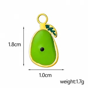 Detailed view of pear shaped green enamel charm with gold plating and 1.8cm size mark
