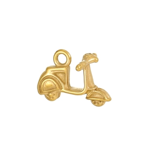 Detailed macro shot of vintage matte 18K gold plated motorcycle pendant accessory