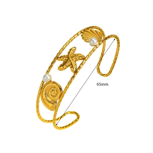 Detail of 18K gold-plated ocean-themed cuff with seashells and 65mm diameter mark