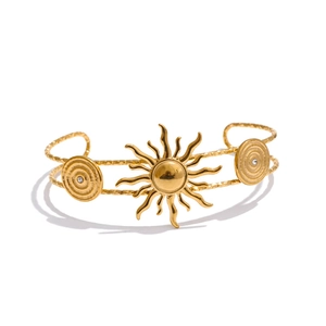 18K gold plated stainless steel open bangle featuring sunburst and seashell spiral motifs