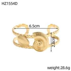 Macro shot of gold stainless steel bangle with seashell and conch motifs and dimensions