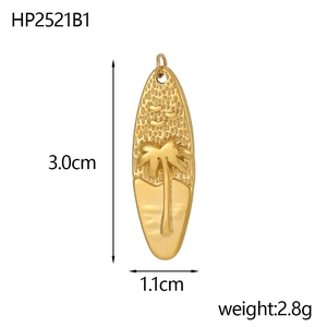 Macro view of surfboard gold pendant with palm tree relief and size measurements