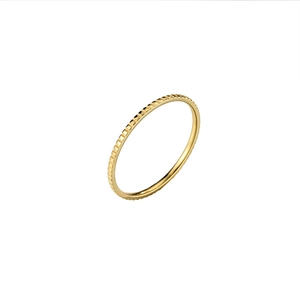 Minimalist gold PVD stainless steel ring featuring uniform groove texture on a white background