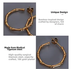 Detail of 18K gold plated surgical titanium steel hoop earrings with bamboo texture
