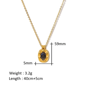 Detailed view of black zircon pendant size 59mm by 5mm on gold chain necklace