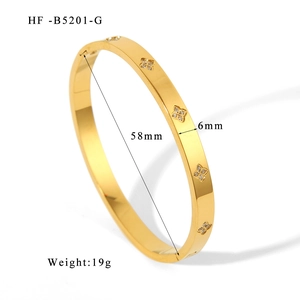 Detailed view of 6mm gold clover bangle with 58mm inner diameter and rhinestone inlay