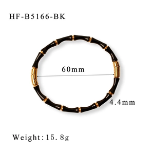 Detailed view of bamboo style titanium steel bracelet with black enamel and 18K gold plating