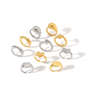 Minimalist stainless steel ring set with heart and teardrop designs in gold and silver