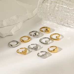 Minimalist stainless steel ring set with heart and water drop designs in gold and silver