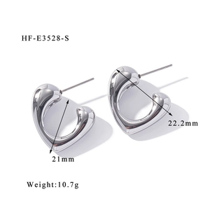 Detailed close-up of heart earrings showing 18K gold plating and liquid metal texture