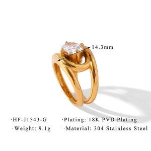 Detail of 18K gold plated double-band ring with oval zircon and 304 stainless steel texture