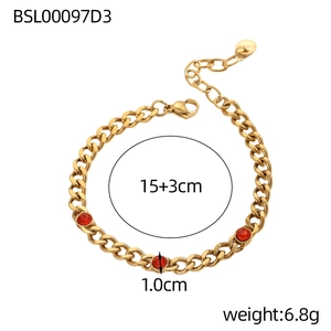 Macro shot of 18K gold plated Cuban chain bracelet with red birthstones and size markers