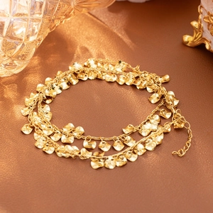 Gold PVD stainless steel layered necklace with hammered disc charms and adjustable chain