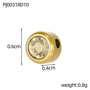 Macro view of gold plated round spacer bead with rhinestones and dimensions 0.6x0.4cm