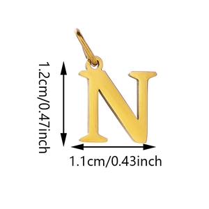 Macro detail of gold letter N pendant measuring 1.2cm height with polished metal finish