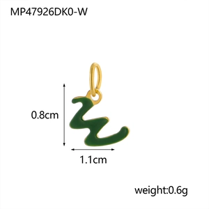 Macro detail of 18K gold-plated letter W charm with green enamel measuring 1.1cm by 0.8cm