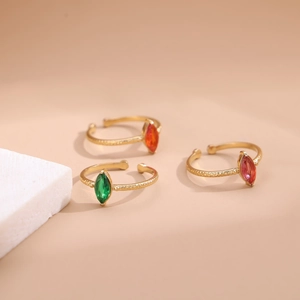 Gold-plated stainless steel rings with marquise-cut green, orange, and pink crystals