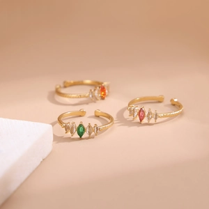 Adjustable gold plated stainless steel rings with marquise colored zircon and hammered finish