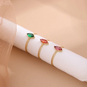 Three gold-plated stainless steel rings with marquise-cut colorful zircon crystals