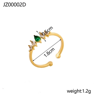 Macro detail of gold-plated ring with hammer texture and green marquise zircon inlay