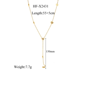 Detail of 18K gold titanium heart necklace showing 55+5cm length and Y-tassel dimensions