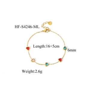 Detail of colorful heart zirconia stones on a gold-plated stainless steel chain bracelet