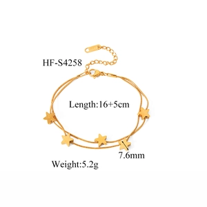 Detail of gold double-layer star bracelet with lobster clasp and adjustable steel chain