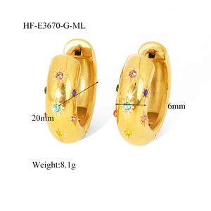 Detail view of 18K gold hoop earrings with colorful zircon star engravings and dimensions