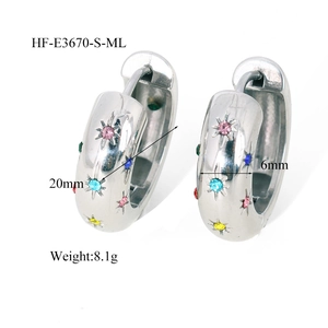 Detail showing 20mm silver hoop earrings with multi-color zircon stars and 6mm width