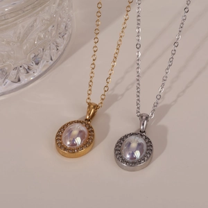 Vintage oval pendant necklace with iridescent stone and crystals in gold and silver finish