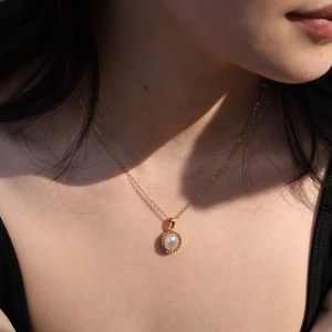 French vintage stainless steel necklace with pearl pendant and pavé rhinestones on model