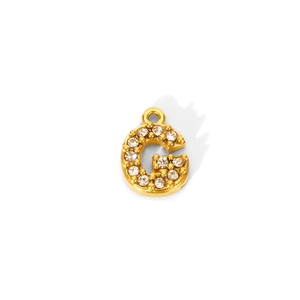 Close-up of 18K gold plated letter G pendant with sparkling cubic zirconia pavé setting