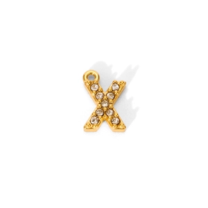 Macro detail of 18K gold plated letter X pendant with pavé cubic zirconia setting